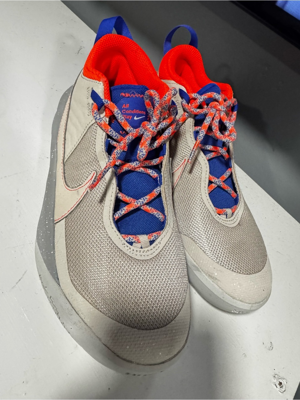 Nike Kids Beige Sneakers with Blue and Orange Accents